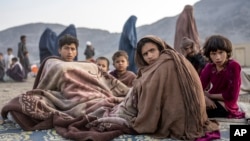 Afghan refugees rest at a camp near the Torkham Pakistan-Afghanistan border crossing in Afghanistan on November 3, 2023. More than half a million Afghans were forced to leave Pakistan when Islamabad announced its plans to expel "undocumented foreigners."