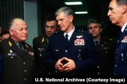 General Igor Sergeyev (left), the commander in chief of the Russian Strategic Rocket Forces, meets with Lieutenant General Dirk Jameson during Sergeyev's tour of U.S. military installations to "establish a rapport" with the United States in December 1993.