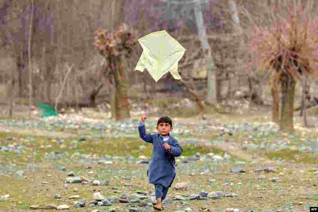 An Afghan boy flies a kite in Badakhshan Province