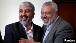 Khaled Meshaal (left) was believed to be a shoo-in to replace Ismail Haniyeh (right) as Hamas leader after he was assassinated in Iran.