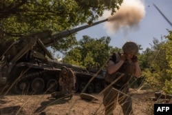 Ukrainian soldiers fire self-propelled artillery toward Russian positions in an undisclosed area of the Pokrovsk district on August 8.