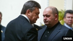 Former Ukrainian government minister Mykola Zlochevskiy (right) was closely associated with ousted President Viktor Yanukovych (left). 