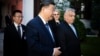 Chinese President Xi Jinping (center) talks with Hungarian Prime Minister Viktor Orban (right) prior to their official talks in Budapest on May 9.