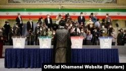 Iranian Supreme Leader Ayatollah Ali Khamenei arrives to cast his vote during the Iranian presidential election in Tehran in 2021.