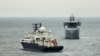 A British warship (right) tracks the Russian vessel Yantar during a previous encounter. (file photo)