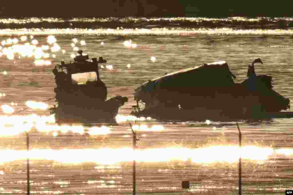 Rescue crews search the waters of the Potomac River near the wreckage of American Airlines flight 5342, which crashed in Washington, D.C.&nbsp;