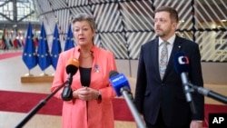 European Commissioner for Home Affairs Ylva Johansson (left) and Czech Interior Minister Vit Rakusan address a press conference at a meeting of EU interior ministers at the European Council building in Brussels on December 8.