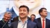 Volodymyr Zelenskiy reacts following the announcement of the presidential election's first exit poll, at his campaign headquarters in Kyiv on April 21, 2019.