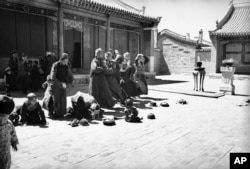 Women praying at a monastery in Mongolia in 1930