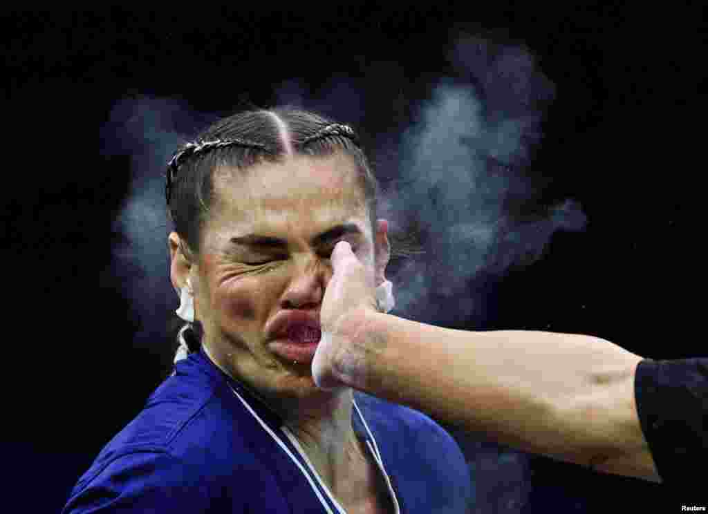 American athlete Jackie Cataline reacts after being hit by Hungary&#39;s Sheena Bathory during their Power Slap super heavyweight title bout in Riyadh, Saudi Arabia, on January 30. Bathory won the contest by unanimous decision.&nbsp;