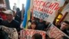 Supporters of ex-President Petro Poroshenko protest inside the State Bureau of Investigation, accusing it of cooperation with officials linked to ex-President Viktor Yanukovych on July 15..