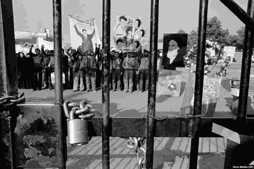 A padlock on the gate of the U.S. Embassy in Tehran on November 27, 1979, with students demonstrating inside after taking control of the compound. They took 52 Americans hostage and demanded the Shah be returned to Iran. The Iran hostage crisis would last 444 days until January 1981.