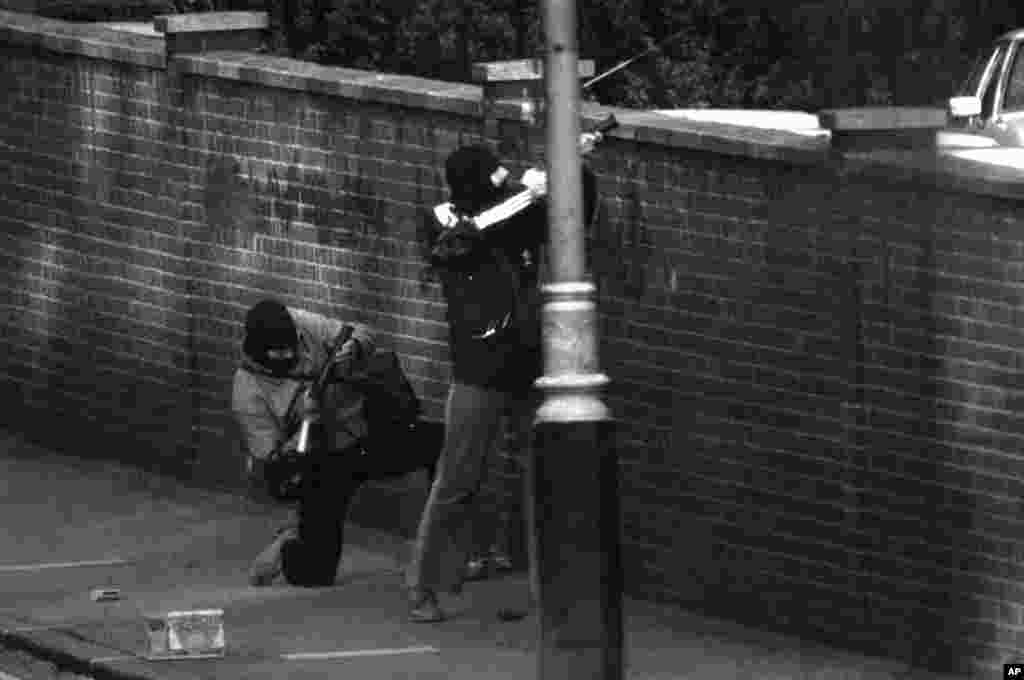 SAS commandos in hoods to avoid identification fire tear gas at the embassy on May 5.