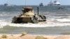 A Russian BTR-82A armored personnel carrier drives onto the shore during military exercises on the Caspian Sea coast in Daghestan in September 2019.