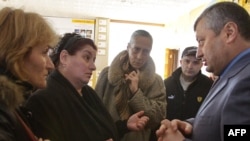 South Ossetia leader Eduard Kokoity (right, seen talking with refugees from South Ossetian conflict zone in Vladikvakaz in March) was the target of the demonstration.