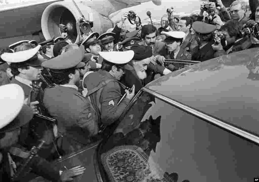 Khomeini was heavily guarded as he tried to leave the airport for his ride through Tehran to visit Behesht-e Zahra cemetery.