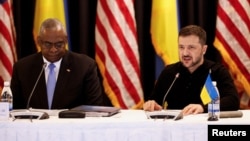 U.S. Defense Secretary Lloyd Austin (left) and Ukrainian President Volodymyr Zelenskiy attend a meeting of the Ukraine Defense Contact Group at the Ramstein Air Base in Germany on September 6.