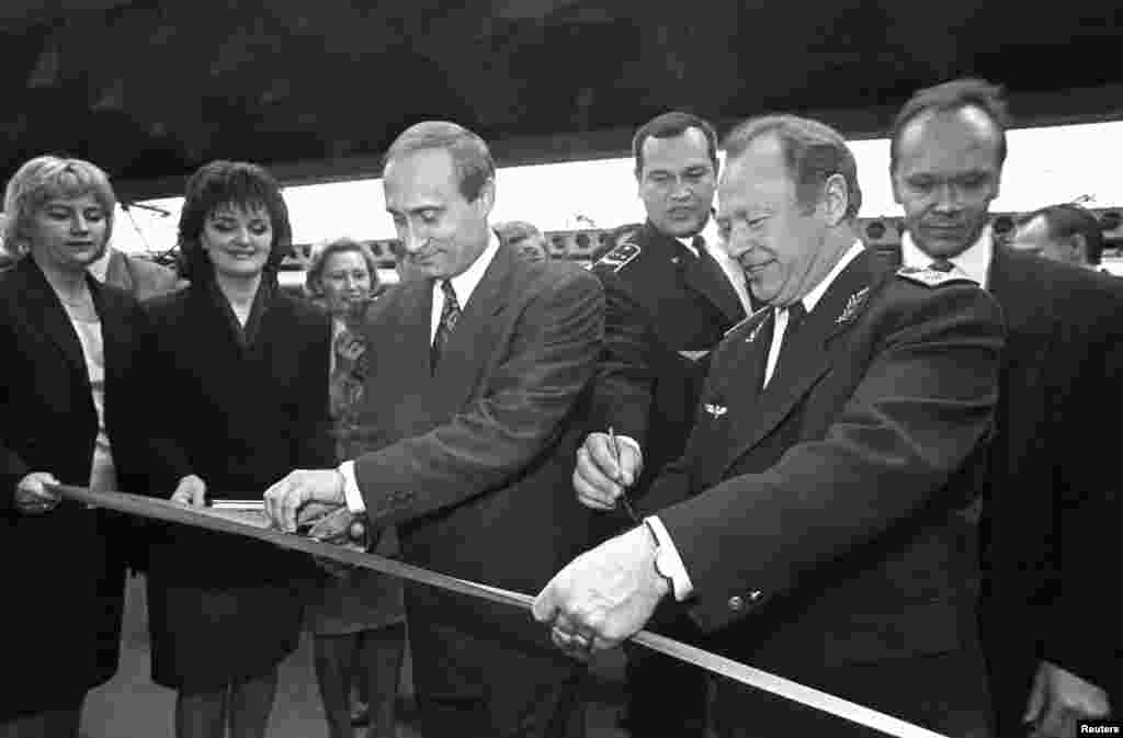 Vladimir Putin, as first deputy mayor, attends a ceremony to open a new booking office at the Moskovsky Railway Station in St. Petersburg on May 12, 1996.