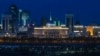 The Akorda (center, with blue dome and golden spire), the official residence of the president, stands out at night amid Astana's skyline.