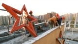 A communist red star is removed from a factory in Budapest in 1989.<br />
<br />
This October 26, 1989, photo was taken three days after Hungary proclaimed itself a democracy after 40 years under Soviet-backed communist rule. The image is one of several that plot the momentous events that transformed Hungary 35 years ago. &nbsp;<br />
<br />
&nbsp;