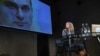 Ksenia Sobchak looks at a picture of Ukrainian prisoner Oleh Sentsov at her press conference in Moscow on October 24. 