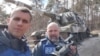 RFE/RL's Ukrainian Service correspondent Roman Pahulych and cameraman Pavlo Kholodov, pictured in Ukraine's Sumy region in 2022.