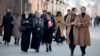 Women walk through a street in the Chechen capital of Grozny. Domestic violence has been a problem in Russia's North Caucasus region for decades. 