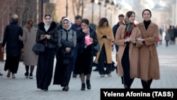 Women walk on a street in the Chechen capital, Grozny. Human rights activists have long accused the North Caucasus region of trampling on the rights of women and minorities. 