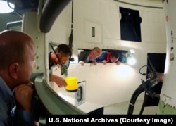 Russian and U.S. inspection teams look into a U.S. Air Force Minuteman II training silo as part of the Strategic Arms Reduction Treaty (START) in South Dakota.