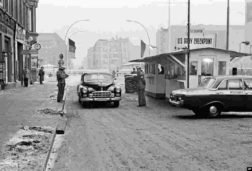 A car crossing from East to West Berlin at Checkpoint Charlie in October 1964. The crossing was the only point through which foreigners were permitted to pass.&nbsp;