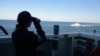 A Ukrainian Navy patrol boat maneuvers in front of a U.S. Coast Guard cutter after exercises in the Black Sea in May.