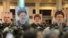 Banners of Iran's late President Ebrahim Raisi and key figures of the 'axis of resistance' are displayed during a ceremony in Tehran on January 2.