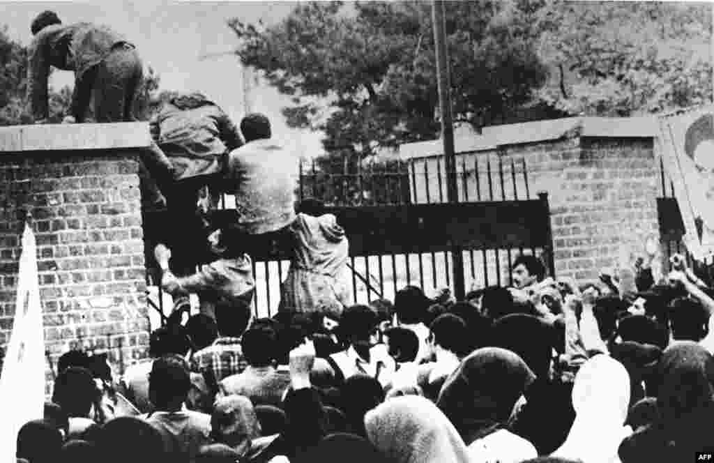 Several hundred young Iranians, supported by a crowd of more than 3,000, climb the walls of the U.S. Embassy at 10:30 a.m. on November 4, 1979. They blindfolded and handcuffed dozens of U.S. citizens they found inside. Protesters had seized the Tehran compound months before, capturing a U.S. Marine on February 14, but order was restored after several hours.