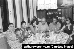 A photo likely taken by Yelena Bonner showing Sakharov with friends and family at their dacha in 1977