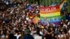 People march across the Szabadsag (Freedom Bridge) over the River Danube in downtown Budapest during a gay pride parade in Budapest in July. 