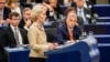 European Commission President Ursula von der Leyen speaks at the European Parliament on October 9 as Hungarian Prime Minister Viktor Orban (right) looks on.