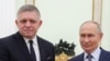 Russian President Vladimir Putin (right) and Slovak Prime Minister Robert Fico pose for a photo prior to talks in Moscow earlier this week. 