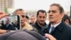 Azerbaijani opposition leader Ali Karimli (right) outside the Nasimi District Court in Baku on December 2.