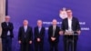 Serbian President Aleksandar Vucic (right) couldn't help cracking a joke at a meeting with health specialists and epidemiologists on February 26 in Belgrade.