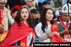 Kyrgyz fans cheer for their team in the Kyrgyzstan-Kazakhstan kok-boru final at the World Nomad Games in Astana on September 12.