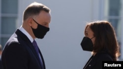 Polish President Andrzej Duda (left) meets with U.S. Vice President Kamala Harris in Warsaw on March 10. 