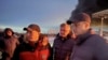 Roman Busargin (right), the governor of Russia's Saratov region, visits an industrial site damaged by a Ukrainian drone strike on January 8.