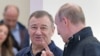 Russian President Vladimir Putin (right) speaks with Arkady Rotenberg as they attend the opening ceremony for a bridge linking the annexed Crimean Peninsula to Russia, in Kerch, in May 2018.