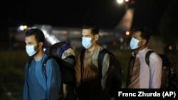 Evacuated Afghans arrive at Tirana International Airport in Albania in August 2021.