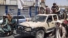 Victorious Taliban fighters drive an Afghan National Army vehicle through the streets of Laghman Province.