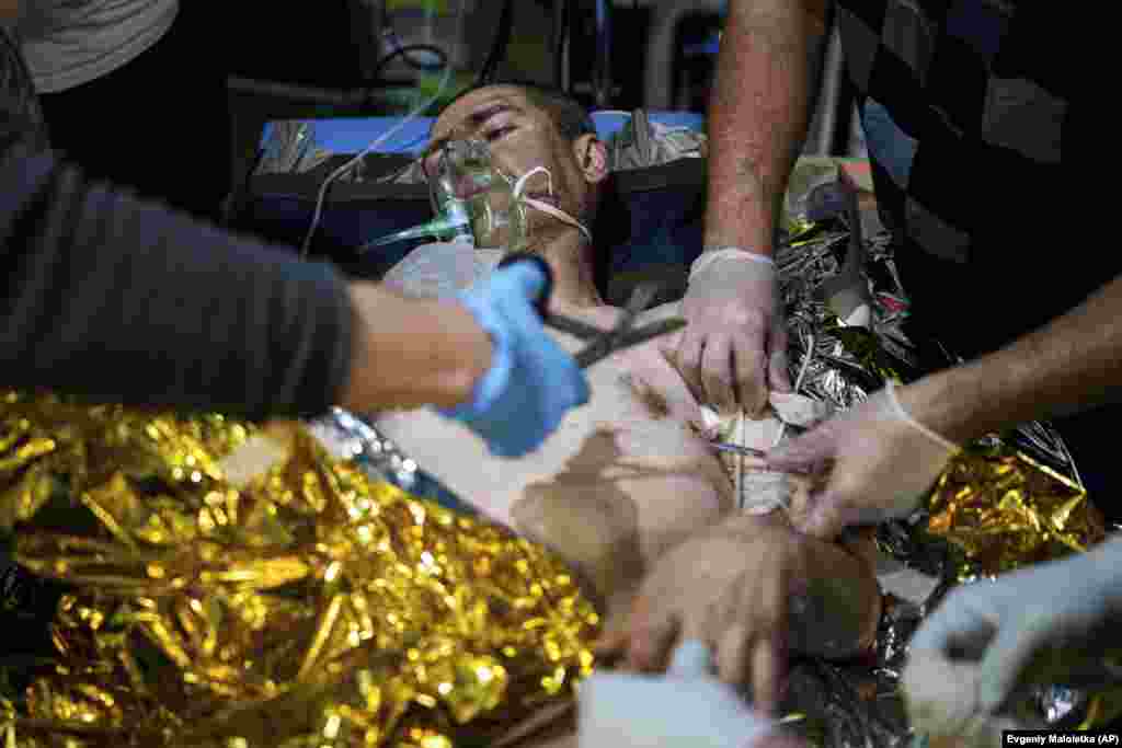  Medics treat an injured Ukrainian soldier of the 108th Separate Battalion &quot;Da Vinci Wolves&quot; near Pokrovsk. &nbsp; 