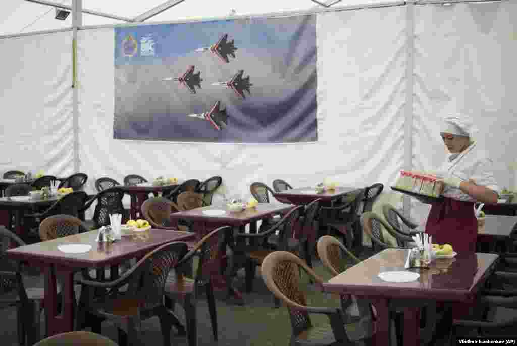 A Russian cafeteria worker prepares tables at the Hmeimim base in October 2015. Robert E. Hamilton, the head of Eurasia research at the Foreign Policy Research Institute, told RFE/RL Syria&#39;s new rulers may be reluctant to tolerate bases from which the Kremlin &quot;launched years of attacks on HTS, other opposition groups, and on Syrian civilians,&quot; throughout the country&rsquo;s civil war.