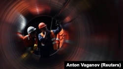 Workers are seen at a construction site of the Nord Stream 2 gas pipeline