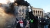 Anti-government demonstrators gather outside the parliament building where Mikheil Kavelashvili was elected as the new president in Tbilisi on December 14.