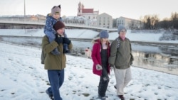 RFE/RL Belarus Service journalist Andrey Kuznechyk (left) spends time with his family in Vilnius after his release from prison in Belarus. 